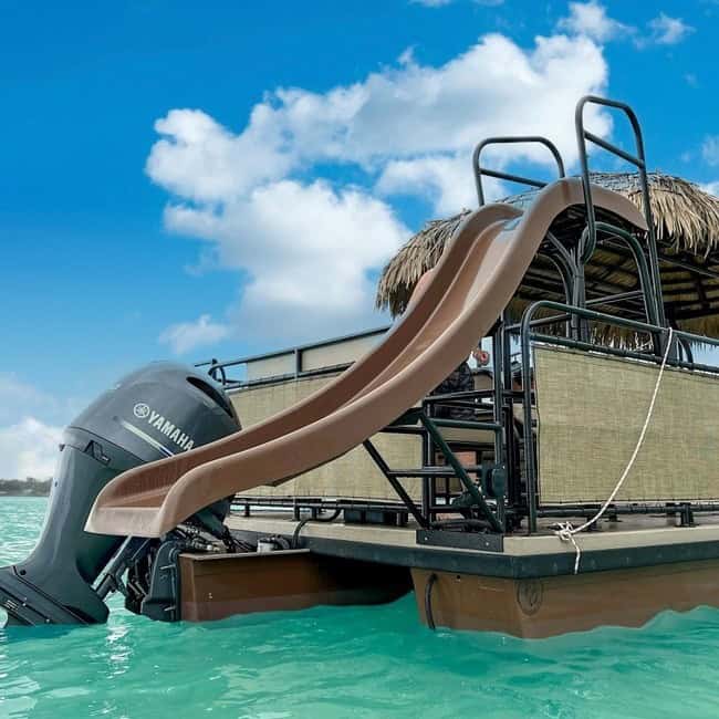 Yardarm boat with slide and Yamaha outboard motor at Key West waters, perfect for boat rentals and group adventures.